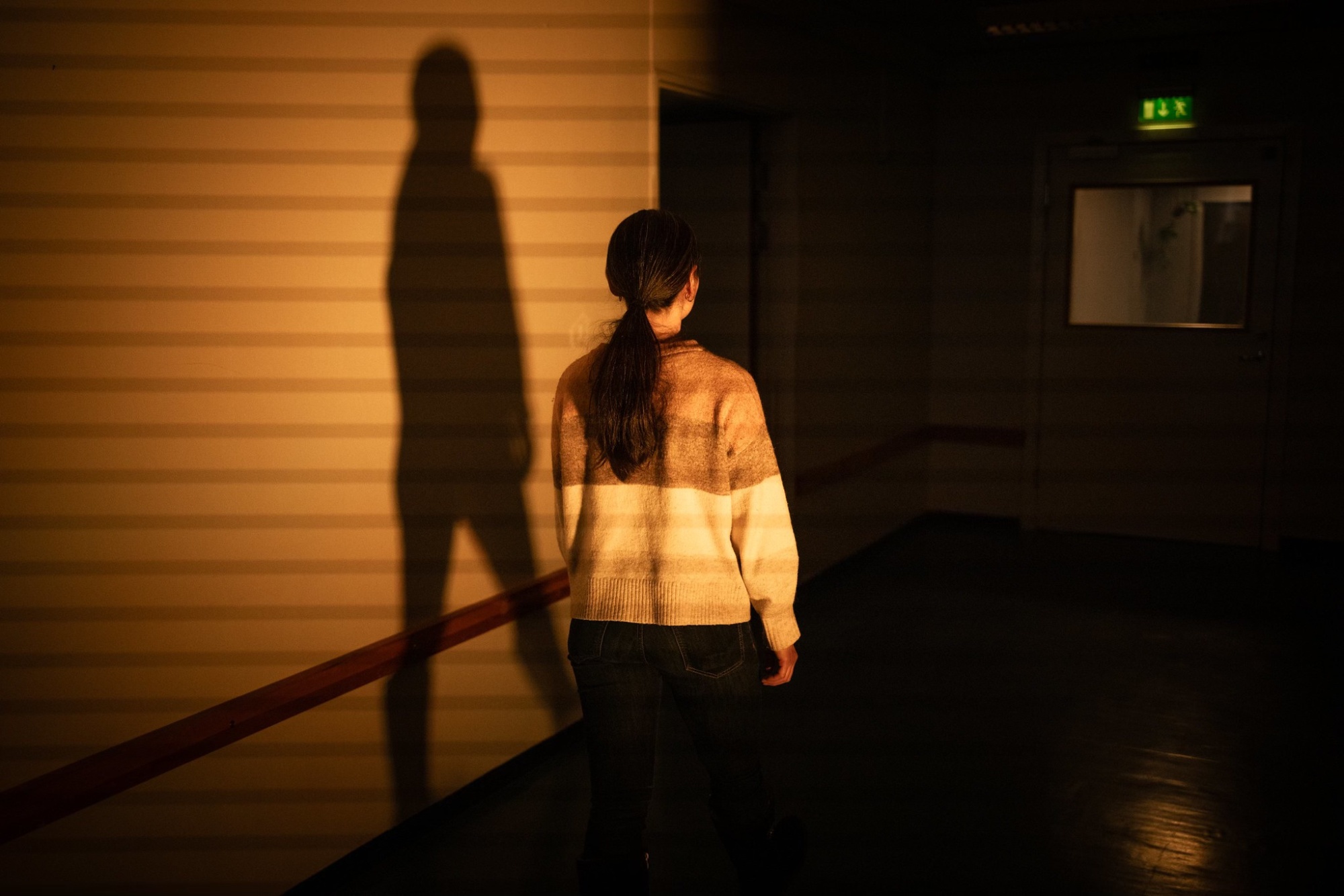 <p>Fig. 5: Rumiko Otsuka guides the audience through the corridor between the sequences in the <em>Liminal Opera</em>, 2025. Photo by Zhanna Guzenko.</p>